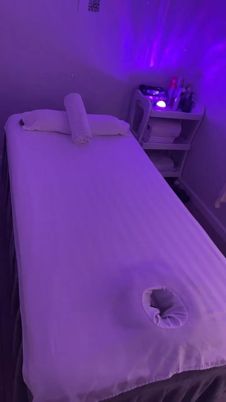 Treatment room with soft purple lighting